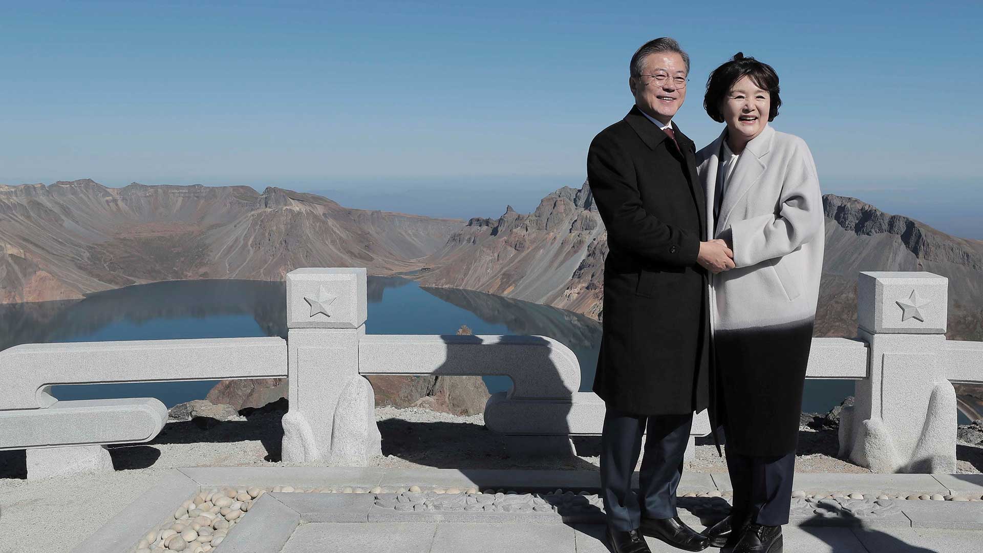 South Korean President Moon Jae-in and first lady Kim Jung-sook pose for photographs on the top of Mt. Paektu