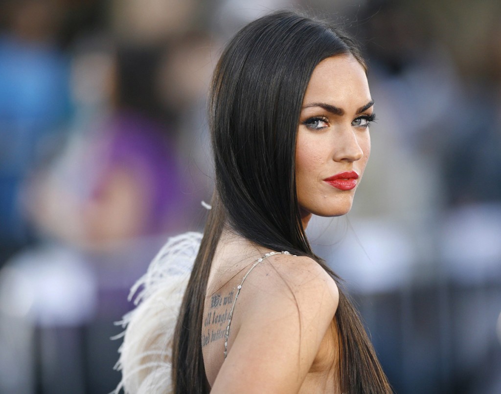 Megan Fox poses at the premiere of Transformers at the Mann's Village theatre in Los Angeles