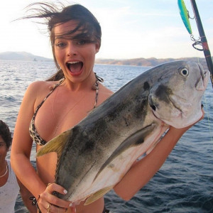 Margot Robbie handling a big catch, 2014
