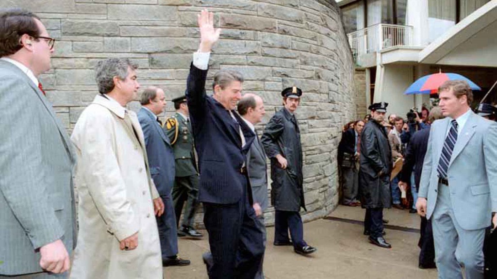 President Reagan waves to the crowd immediately before being shot outside the Washington Hilton Hotel
