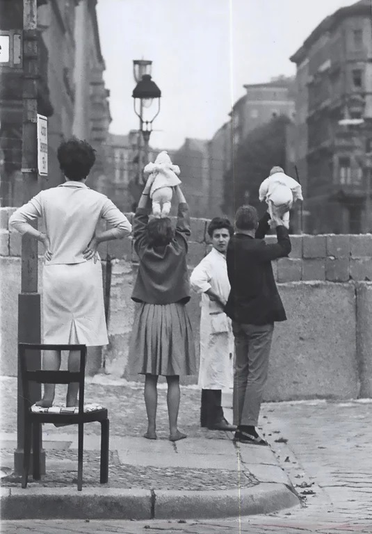 Residents of West Berlin show their children to their grandparents living in East Berlin, 1961