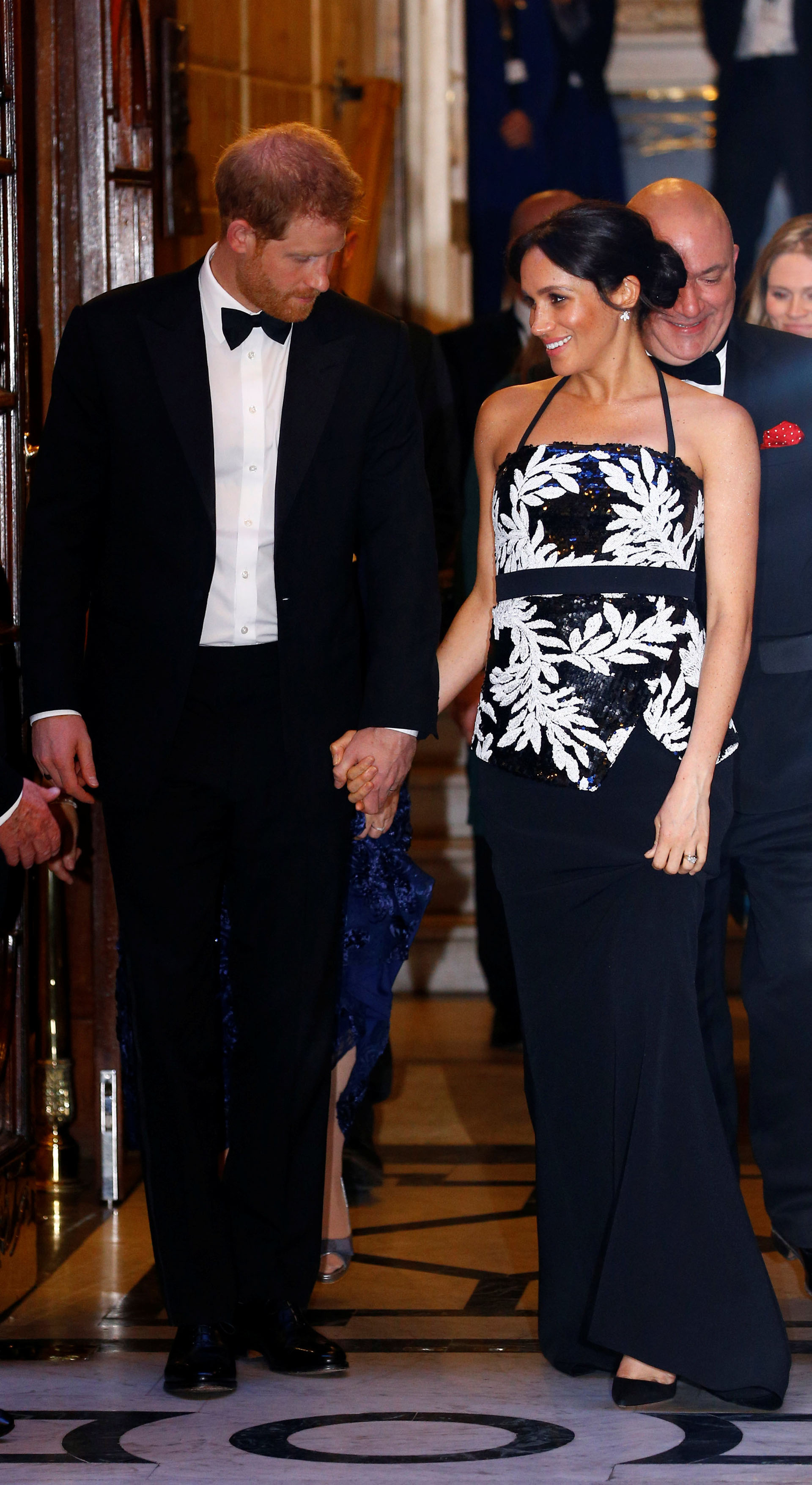 Britain's Prince Harry and Meghan, the Duchess of Sussex, leave after the Royal Variety Performance in London